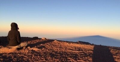 meditator on a hill top